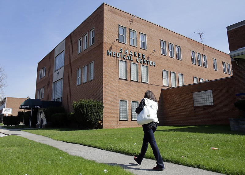 A woman walks past the Center for Women's Health, in Cleveland, Ohio, in this April 28, 2015 photo.