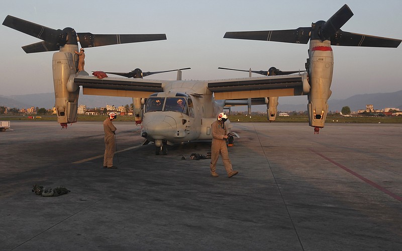 A US Air Force Bell Boeing V-22 Osprey aircraft stands at the Tribhuvan International airport in Kathmandu, Nepal, Sunday, May 3, 2015. Runway damage forced Nepalese authorities to close the main airport Sunday to large aircraft delivering aid to millions of people following the massive earthquake, but U.N. officials said the overall logistics situation was improving. 