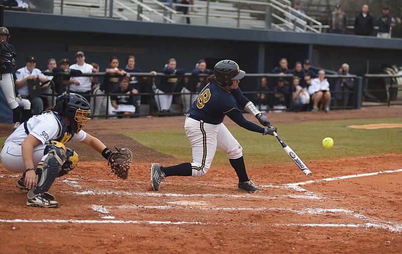 	Staff photo by John Rawlston/Chattanooga Times Free Press - Mar 22, 2015
UTC's Anyssa Robles hits a sacrifice fly to drive in the final run of a four-run first-inning rally as the UTC softball team plays UNC Greensboro in the final game of a Southern Conference weekend series Sunday, Mar. 22, 2015, in Chattanooga. UTC won by a score of 5-4. 