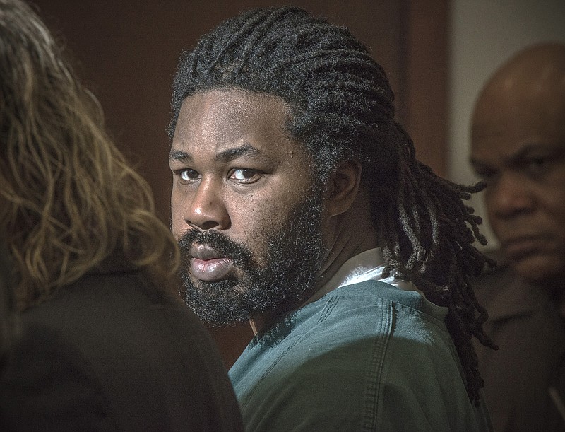 
              FILE - In this Nov. 14, 2014, file photo, Jesse Matthew Jr. looks toward the gallery while appearing in court in Fairfax, Va. Matthew, accused of abducting and killing University of Virginia student Hannah Graham has been charged with capital murder and a prosecutor said Tuesday, May 5, 2015, she will seek the death penalty if the case goes to trial. (Bill O'Leary/The Washington Post via AP, Pool, File)
            