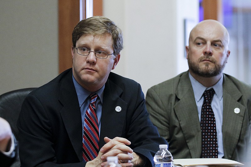 Director of communications Billy Faires, left, and assistant director of communications Jim Tanner listen during an editorial board interview on May 5, 2015, at the Chattanooga Times Free Press offices.