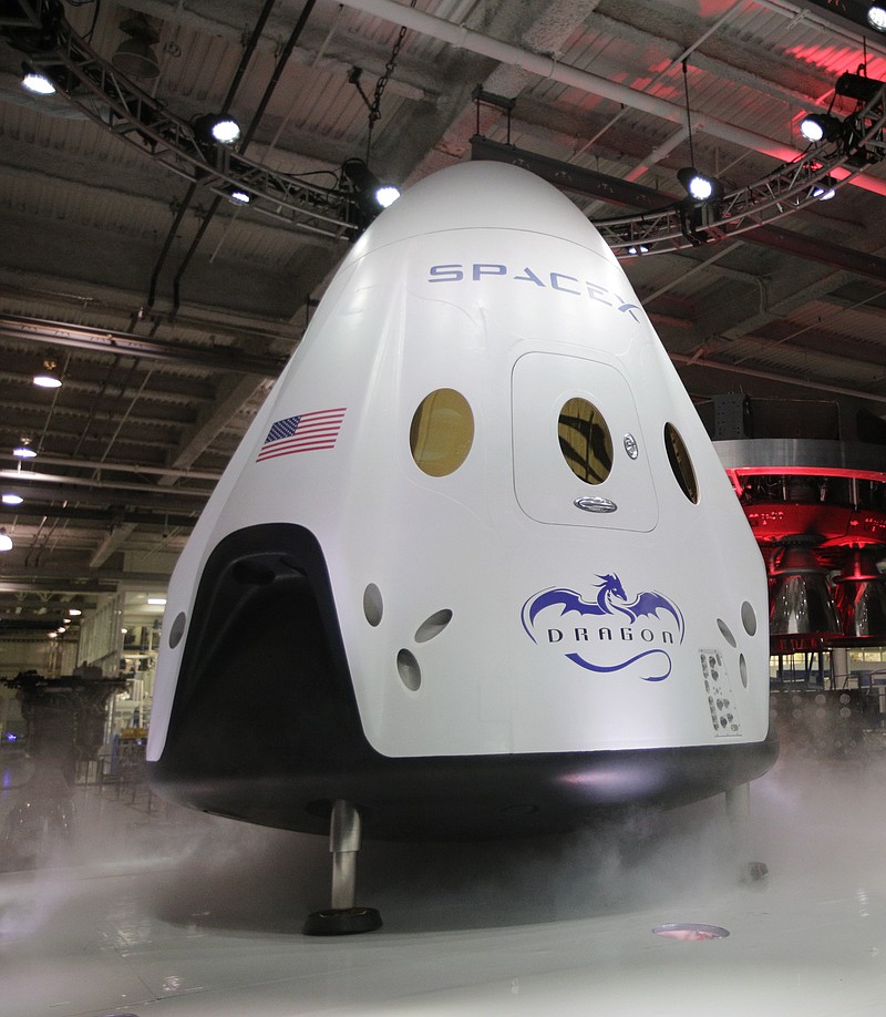 
              FILE - In this May 29, 2014, file photo, the SpaceX Dragon V2 spaceship is unveiled at its headquarters in Hawthorne, Calif. SpaceX is scheduled to conduct the first major test of its brand new, super-streamlined launch escape system for astronauts, Wednesday, May 6, 2015. (AP Photo/Jae C. Hong, File)
            