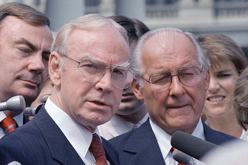 
              FILE - In this Aug. 5, 1987 file photo, then-House Speaker Jim Wright of Texas, left, and then-House Minority Leader Robert Michel of Ill. speak to reporters outside the White House in Washington. Wright, a veteran Texas congressman who was the first House speaker in history to driven out of office in midterm, has died. He was 92.  (AP Photo/Barry Thumma, File)
            