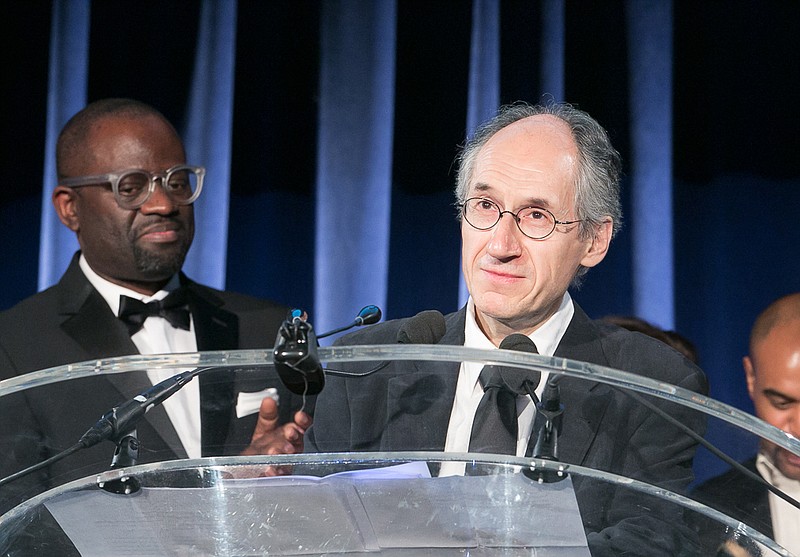 
              In this May 5, 2015 photo released by the PEN American Center, Charlie Hebdo Editor-in-Chief  Gerard Biard accepts the Freedom of Expression Courage Award  as Alain Mabanckou,, left, looks on during the 2015 PEN Gala at the American Museum of Natural History in New York. (Beowulf Sheehan/PEN American Center via AP)
            