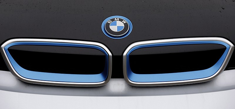 
              FILE- In this file photo dated Tuesday, Jan. 20, 2015, the logo of German car manufacturer BMW is pictured on a BMW i3 electric drive car at the production line in Dingolfing, Germany.  The world’s leading maker of premium cars by volume, BMW is scheduled to report first-quarter business results on Wednesday May 6, 2015. (AP Photo/Matthias Schrader, FILE)
            