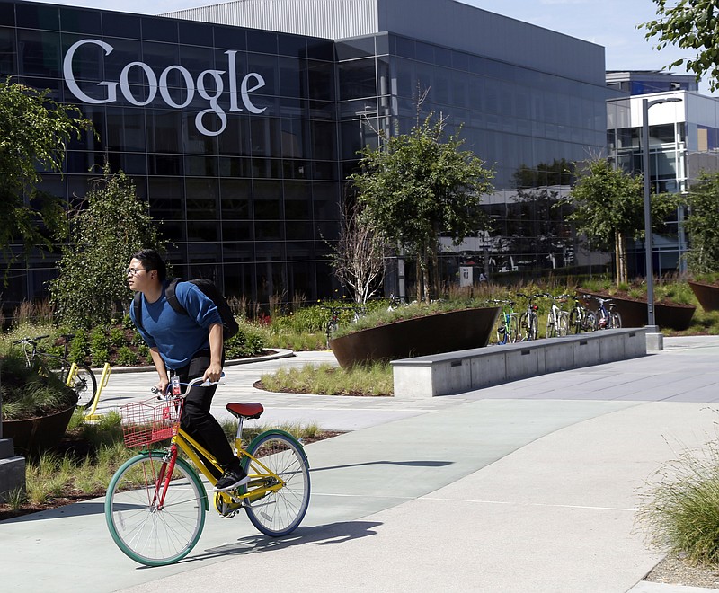 
              FILE - In this June 5, 2014 file photo, a worker rides a bike on Google's campus in Mountain View, Calif. Google, Yahoo and other major technology companies are far more inclined to hire Asians as computer programmers than to promote them to become managers or executives, according to a study released Wednesday, May 6, 2015. (AP Photo/Marcio Jose Sanchez, File)
            