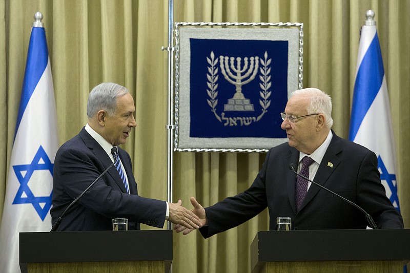 Israeli Prime Minister Benjamin Netanyahu, left, Israeli President Reuven Rivlin, right, during a brief ceremony in the president's residence, on Monday, April 20, 2015, in Jerusalem.