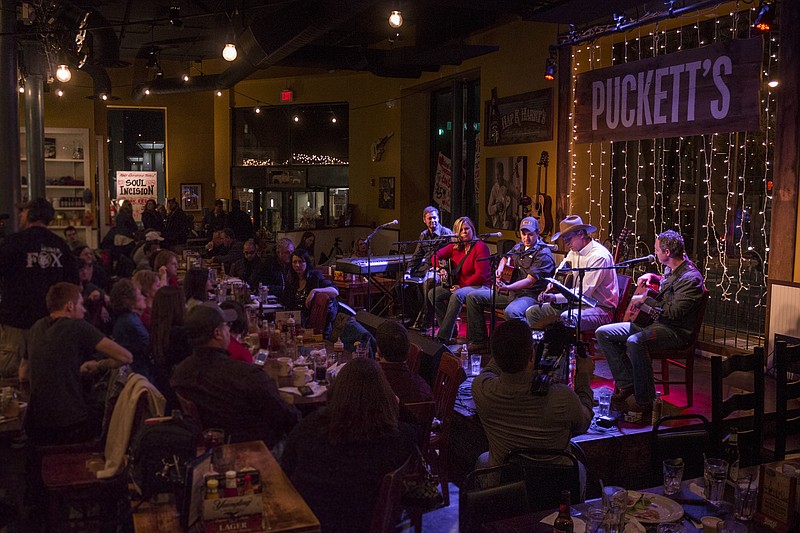 Customers enjoy music at Puckett's Grocery and Restaurant in Nashville in this file photo.