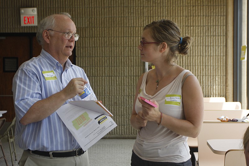 Pete Cooper, left, and Alison Burke discuss issues in the Chattanooga community in this 2010 file photo.