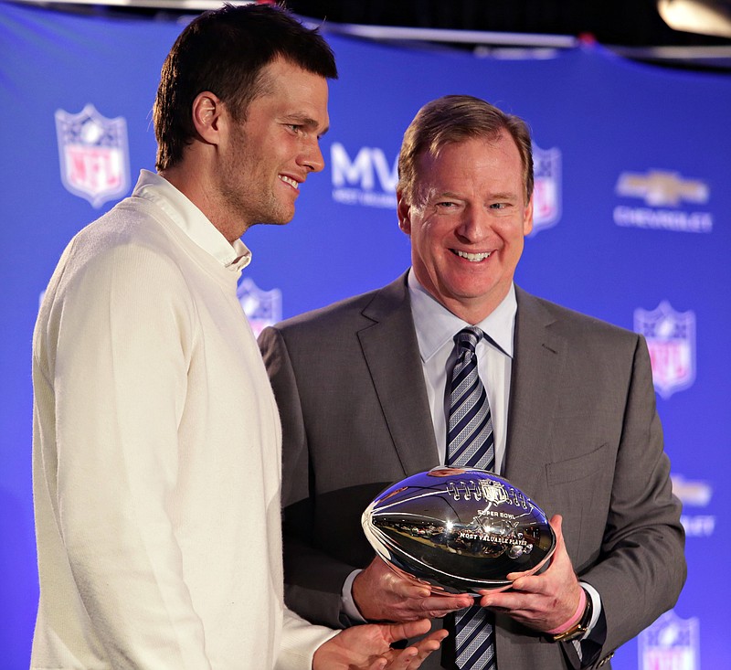 New England Patriots quarterback Tom Brady, left, poses with NFL Commissioner Rodger Goodell during a news conference where Brady was presented the Super Bowl MVP  in Phoenix, Ariz., in this Feb. 2, 2015, file photo.