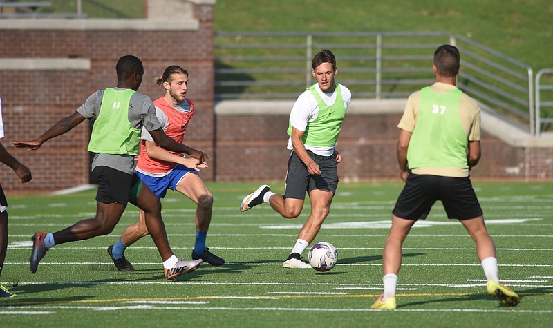 Chattanooga Football Club's Sias Reyneke, second from right, and Kenneth Kauker, second from left, practiceat Finley Stadium on  Friday, May 8, 2015.