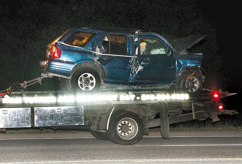 
              A vehicle is towed away after an accident on U.S. Highway 411 South near Maryville, Tenn., late Thursday, May 7, 2015.  Six people, including three children, have been killed in a crash in eastern Tennessee, the Tennessee Highway Patrol said.  (Daryl Sullivan /The Daily Times via AP)
            