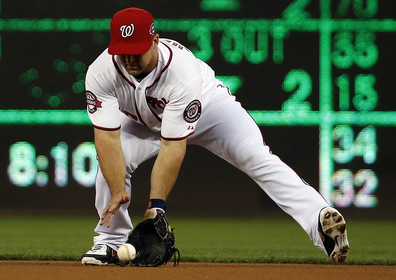 Washington Nationals second baseman Dan Uggla fields a ball hit by Miami Marlins' Dee Gordon in this May 5, 2015, file photo.