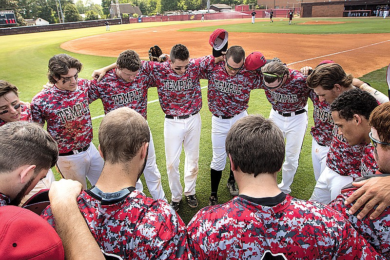 Tennessee Temple baseball players pray before a Crusaders' scrimmage game on Friday, May 8, 2015, in Cleveland, Tenn. This marks the final year for TTU's baseball team.