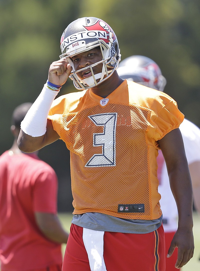 
              Tampa Bay Buccaneers quarterback Jameis Winston calls out a play during drills in an NFL rookie minicamp in Tampa, Fla., Friday, May 8, 2015. (AP Photo/Wilfredo Lee)
            