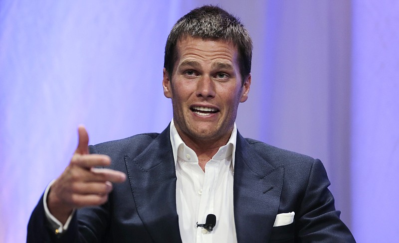 
              FILE - In a Thursday, May 7, 2015 file photo, New England Patriots quarterback Tom Brady gestures during an event at Salem State University in Salem, Mass. The NFL suspended Brady for the first four games on Monday, May 11, 2015, for his role in a scheme to deflate footballs used in the AFC title game. (AP Photo/Charles Krupa, Pool, File)
            