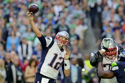 In this Jan. 31, 2015, file photo, New England Patriots Tom Brady (12) throws during the NFL Super Bowl XLIX football game against the Seattle Seahawks Glendale, Ariz. The New England Patriots will host the Pittsburgh Steelers to open the NFL season on Sept. 10. The game will match quarterbacks with six Super Bowl rings and nine Super Bowl appearances: Tom Brady vs. Ben Roethlisberger.(AP Photo/Gregory Payan, File)
