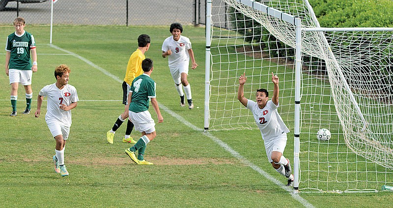 Dalton's Gibby Perez, right, celebrates after scoring a goal to put his team up 3-0 as Dalton hosts Greenbrier in a Class AAAAA state semifinal soccer match Tuesday at Harmon Field. The nationally top-ranked Catamounts won 6-0.