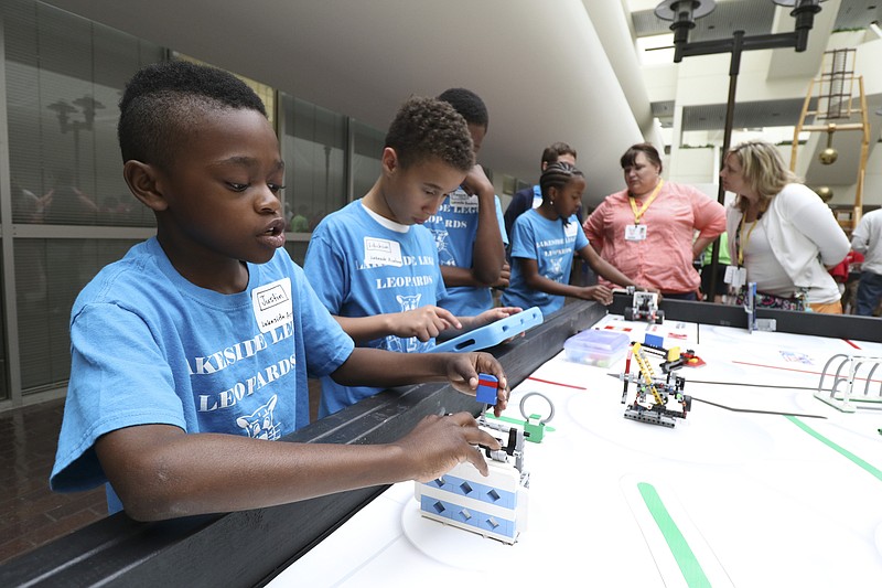 Justin Flanagan, a Lakeside Elementary 5th Grader, participates in a robotics showcase at TVA in downtown Chattanooga on Wednesday, May 13, 2015. 