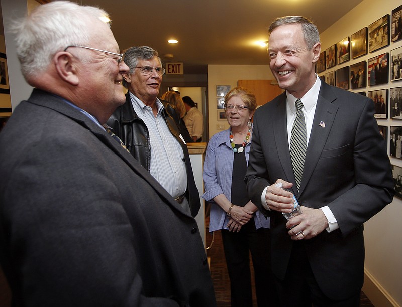 
              Former Maryland Gov. Martin O'Malley, right, talks with New Hampshire State Rep. Bob Backus, left, and former State Sen. Peter Burling before a private meeting with New Hampshire Democrats, Wednesday, May 13, 2015, in Concord, N.H. (AP Photo/Jim Cole)
            