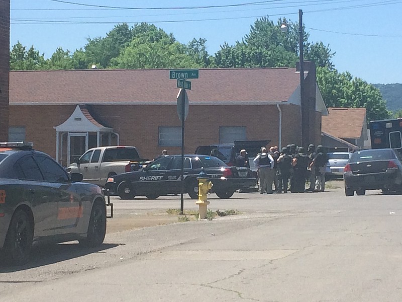 Police told residents in a Rossville neighborhood to lock their doors and get to a safe place because officers had become involved involved in a nearby standoff.