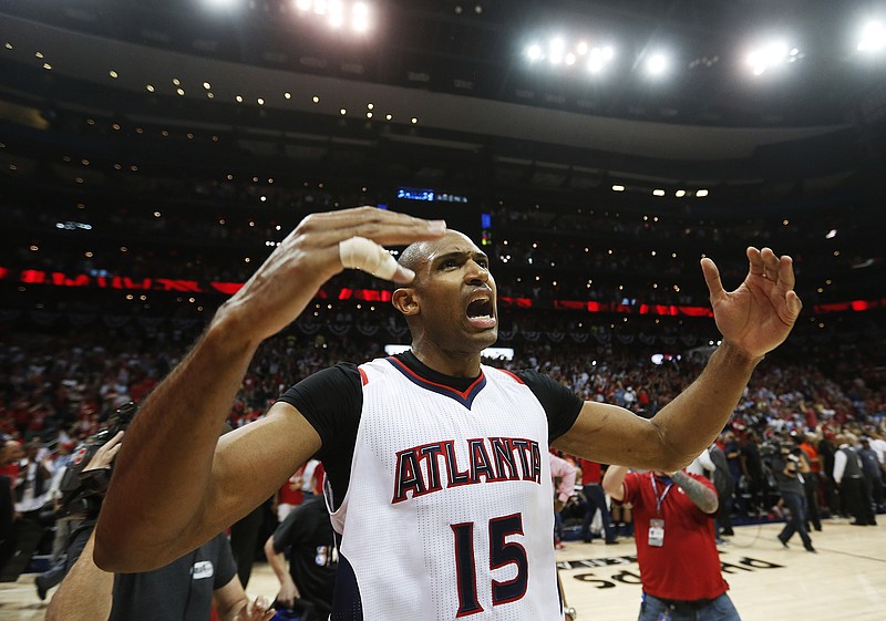 Atlanta Hawks' Al Horford celebrates after the Hawks beat the Washington Wizards 82-81 in Game 5 of their NBA basketball playoffs Wednesday, May 13, 2015, in Atlanta.