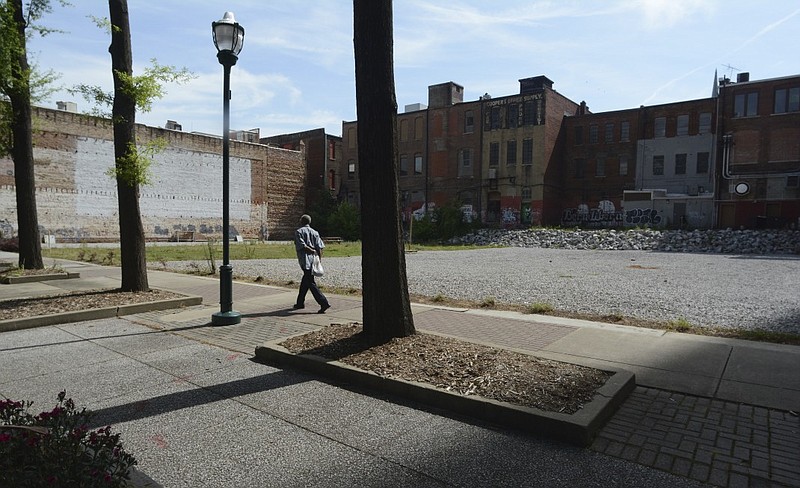 This vacant lot was created when buildings were torn down 15 years ago for a project that did not materialize in the 700 block of Market Street. A company has bought the property, seen Thursday, May 14, 2015 in Chattanooga, and plans to redevelop the site.