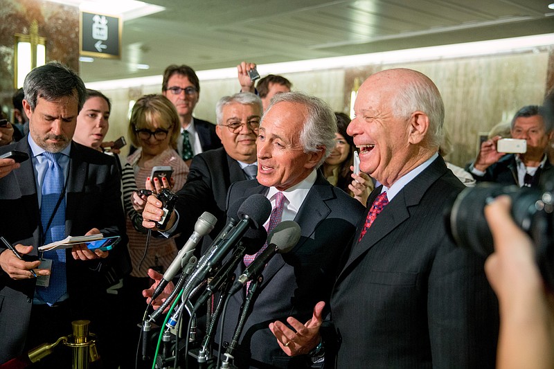 Senate Foreign Relations Committee Chairman Sen. Bob Corker, R-Tenn., center, and the committee's ranking member Sen. Ben Cardin, D-Md., speak to reporters on Capitol Hill in Washington on April 14. The Senate muscled its way into President Barack Obama's talks to curb Iran's nuclear program, overwhelmingly backing legislation that would let Congress review and possibly reject any final deal with Tehran.