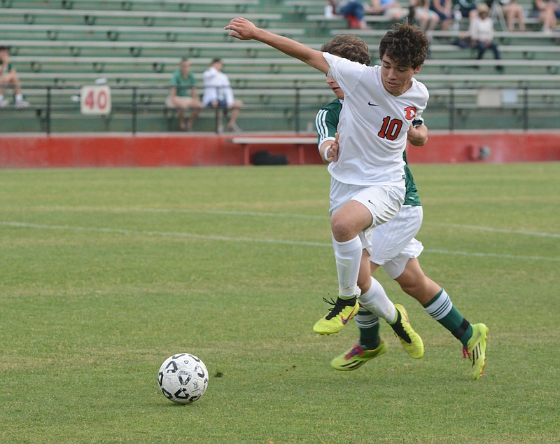 Dalton's Kobe Perez (10) battles defender Alex Vasquez for the ball as Dalton hosts Greenbrier in a Class AAAAA state semifinal soccer match in Dalton, Ga. in this May 12, 2015, file photo.