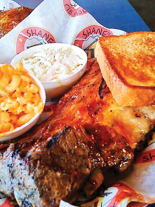  A half rack of baby back ribs is served with macaroni-and-cheese, coleslaw and Texas toast at Shane's Rib Shack in Cleveland, Tenn. 