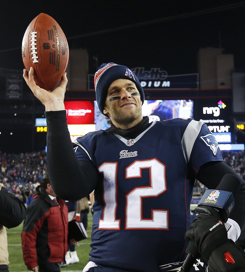 
              FILE - In this Jan. 10, 2015, file photo, New England Patriots quarterback Tom Brady holds up the game ball after an NFL divisional playoff football game against the Baltimore Ravens in Foxborough, Mass. Tom Brady is expected to file an appeal of his four-game suspension for his role in deflating footballs for the AFC championshjip game.  (AP Photo/Elise Amendola, File)
            