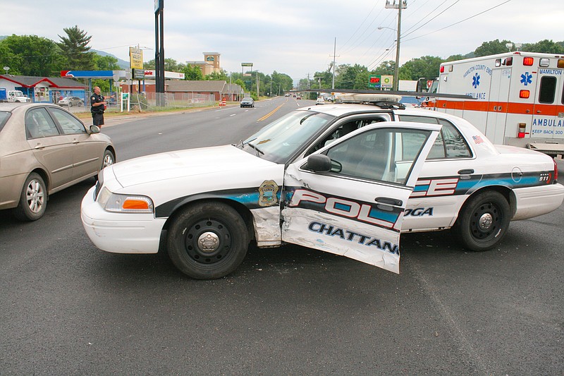 A 16-year-old boy ran a red light and crashed into a Chattanooga police officer's patrol car around 8:30 a.m. today on Browns Ferry Road, according to police. 