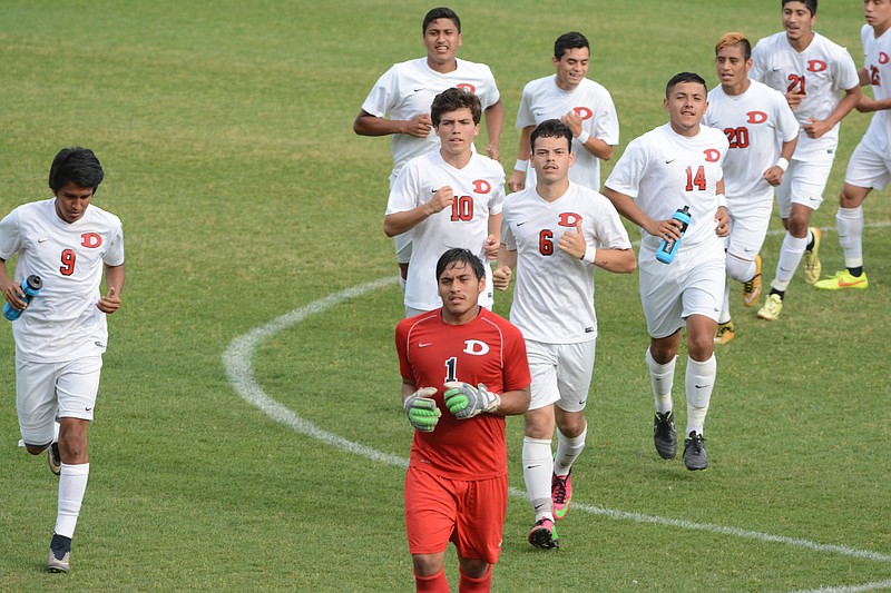 Led by goalkeeper Leuri Fraire, the Dalton soccer team runs onto the field as they host Greenbrier in a Class AAAAA state semifinal soccer match in Dalton, Ga., in this May 12, 2015, photo.