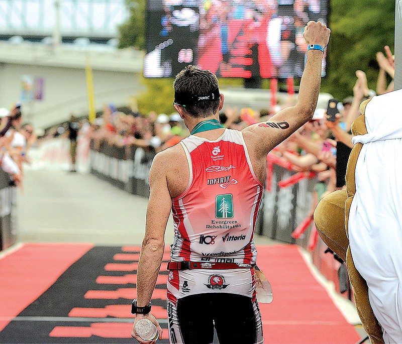 Matt Hanson of Storm Lake, Iowa, waves to the crowd after winning the full Ironman Chattanooga in this September 2014 file photo.