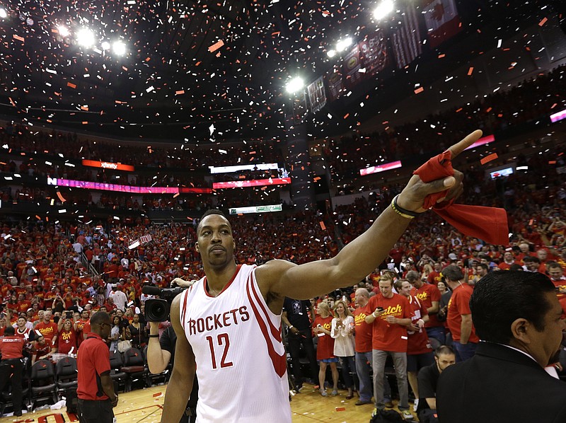 Houston Rockets' Dwight Howard (12) celebrates after beating the Los Angeles Clippers 113-100 in Game 7 of the NBA basketball Western Conference semifinals on Sunday, May 17, 2015, in Houston.