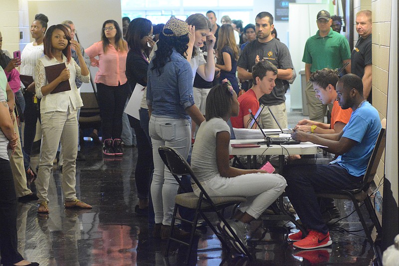 Devin Washington, right, interviews Keianna Lofton at an Amazon job fair at the Brainerd Crossroads on Tuesday, May 19,  2015, in Chattanooga, Tenn.