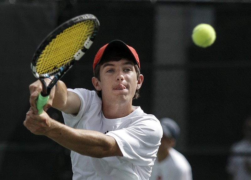 Baylor tennis player Jack Gray returns the ball during his boys' II-AA state team tennis tournament semifinal doubles match against MBA on Tuesday, May 19, 2015, at the TSSAA Spring Fling in Murfreesboro, Tenn.