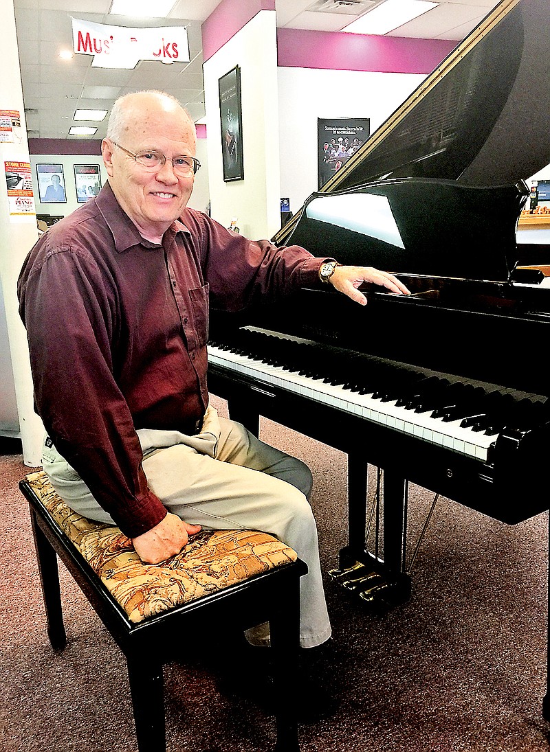 Larry Otto, of Crutcher Pianos, has been working extra hours during the store's going- out-of-business sale.