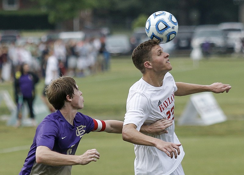 Baylor forward Kyle Jonston, right, heads the ball away from Christian Brothers' Jake Barrett during their Division II-AA state soccer semifinal match Wednesday, May 20, 2015, at the TSSAA Spring Fling in Murfreesboro, Tenn.