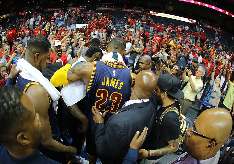 Cleveland Cavaliers forward LeBron James (23) walks off the court after their Game 1 of the Eastern Conference finals of the NBA basketball playoffs against Atlanta Hawks, Wednesday, May 20, 2015, in Atlanta. The Cleveland Cavaliers won 97-89. 