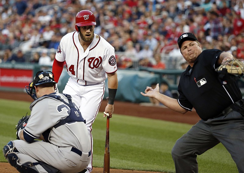 
              Washington Nationals' Bryce Harper (34) is ejected by home plate umpire Marvin Hudson during the third inning of a  baseball game against the New York Yankees at Nationals Park, Wednesday, May 20, 2015, in Washington. Nationals manager Matt Williams was later ejected by Hudson. (AP Photo/Alex Brandon)
            