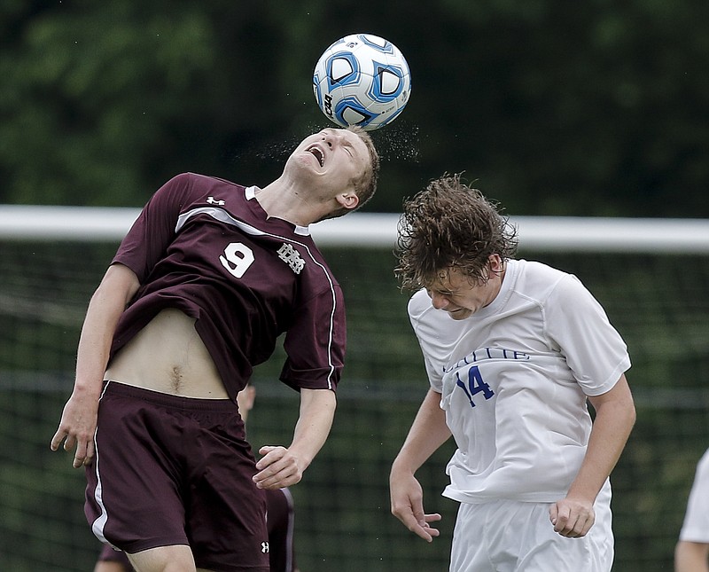 McCallie's Jonah Bryan (14) and MBA's Curtis Turner go up to head the ball during their Division II-AA state soccer semifinal match at the TSSAA Spring Fling in Murfreesboro, Tenn., on Wednesday, May 20, 2015.