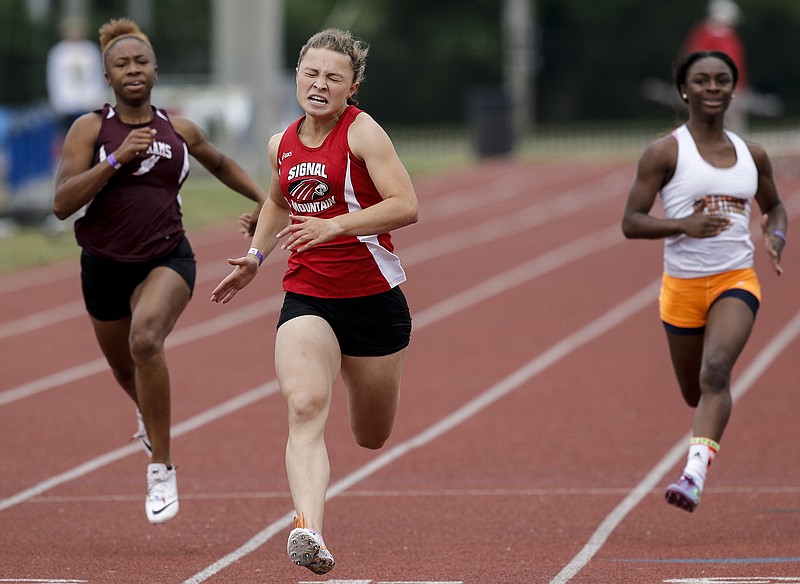 Signal Mountain athlete McKenzie Ethridge, center, competes in the A-AA girls 100 meter dash with Tyner's Alexis Wilson, left, and Stratford's Jermesia Haynes at the state track and field championships Thursday, May 21, 2015, during the TSSAA Spring Fling in Murfreesboro, Tenn.