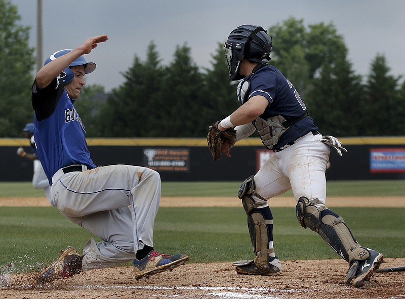 Boyd-Buchanan runner Skyler Anderson crosses home for a run around Knoxville Grace catcher Hayden Coffman during their Division I-A state baseball tournament game against Knoxville Grace on Thursday, May 21, 2015, at the TSSAA Spring Fling in Murfreesboro, Tenn.