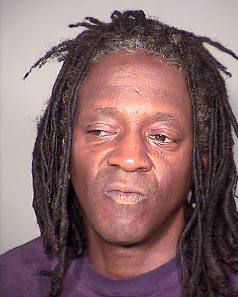 
              This undated booking photo provided by the Clark County Detention Center shows William Drayton Jr. aka Flavor Flav after his arrest in Las Vegas. Authorities say they arrested the entertainer shortly after midnight on Thursday, May 21, 2015, in Las Vegas for driving under the influence, speeding, possessing less than an ounce of marijuana and having an open container of alcohol in the 2005 black BMW he was driving. (Clark County Detention Center via AP)
            