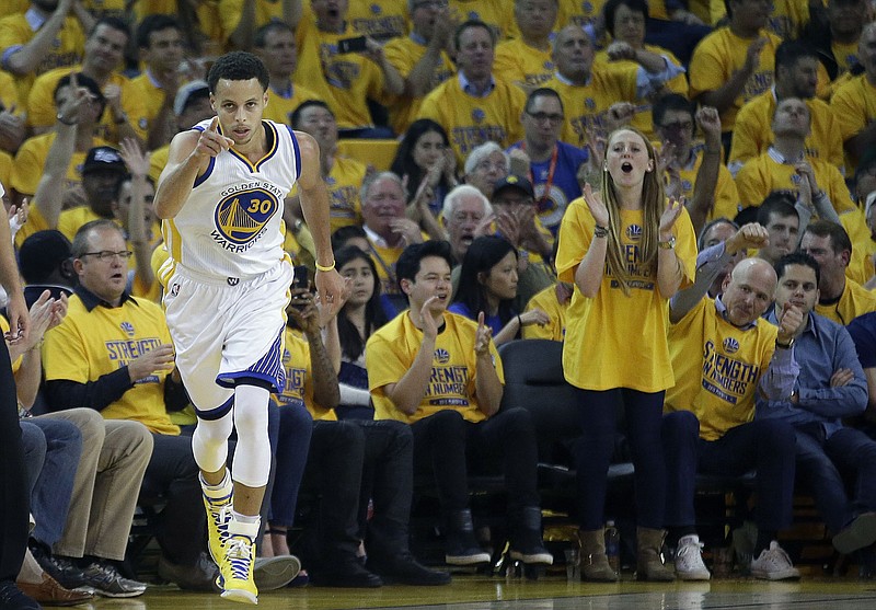
              Golden State Warriors guard Stephen Curry (30) reacts during the first half of Game 2 of the NBA basketball Western Conference finals against the Houston Rockets in Oakland, Calif., Thursday, May 21, 2015. (AP Photo/Rick Bowmer)
            