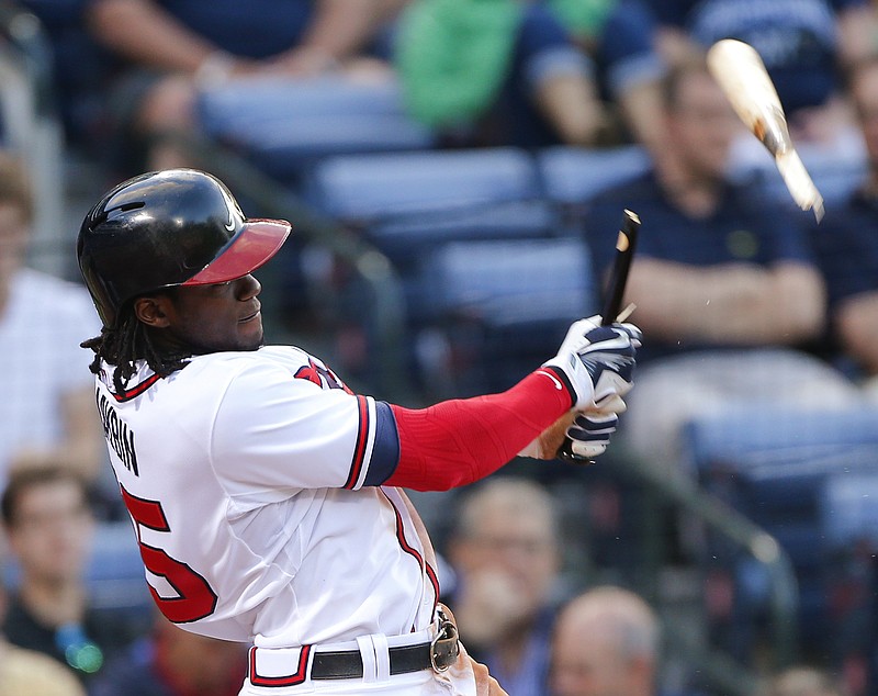Atlanta Braves' Cameron Maybin breaks his bat as he flies out in the third inning of a baseball game against the Milwaukee Brewers on Thursday, May 21, 2015, in Atlanta. 