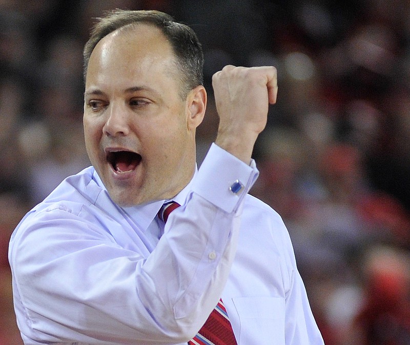 Georgia head coach Mark Fox celebrates after a basket during an NCAA college basketball game between Georgia and Vanderbilt on Tuesday, Jan. 27, 2015, in Athens, Ga.