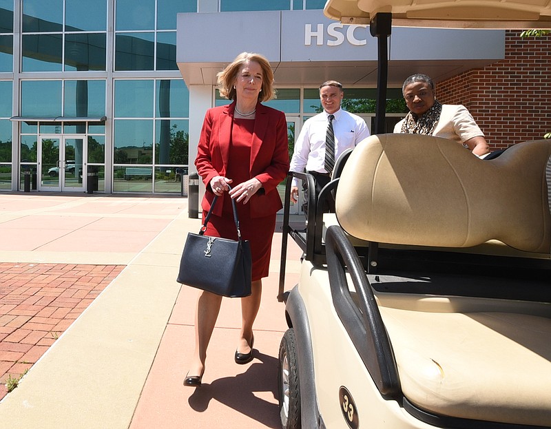 Dr. Flora Tydings, left, President of Athens Technical College in Georgia, leaves the Chattanooga State Health Science Center in this May 6, 2015, photo.