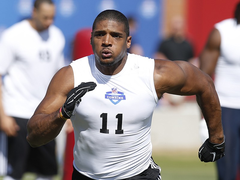 Michael Sam runs through a drill during the NFL Super Regional Combine football workout in Tempe, Ariz., in this March 22, 2015, file photo.